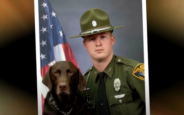 Unstoppable Affection: Police Dog Overwhelms Officer with Kisses During Photo Op-1