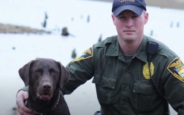 Unstoppable Affection: Police Dog Overwhelms Officer with Kisses During Photo Op-2